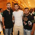 Jordi Alba (R), with his teammates Gerard Pique (L) and Sergio Busquets in the Mall of Qatar in Doha, entered the debate on the Gulf diplomatic crisis when he was seen autographing a picture associated with Qatari resistance