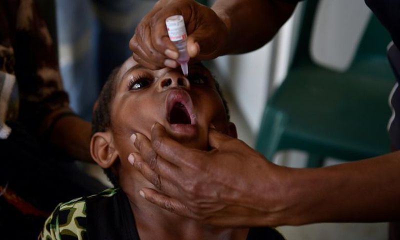 Six-year-old Warapnong Ponde is given a polio vaccination in a mobile clinic in rural Papua New Guinea, as the impoverished country fights a new outbreak of a disease which had previously been eradicated