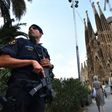 A police officer stands by the Sagrada Familia basilica in Barcelona