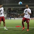 Qatar's national team players wear t-shirts bearing portraits of Emir Sheikh Tamim bin Hamad Al-Thani, in support the Qatari leader in the ongoing Gulf diplomatic crisis as they warm up before their match against South Korea June 13, 2017