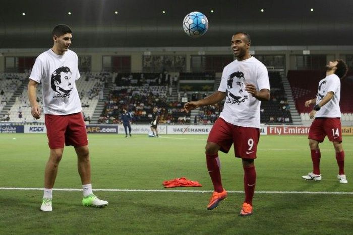 Qatar's national team players wear t-shirts bearing portraits of Emir Sheikh Tamim bin Hamad Al-Thani, in support the Qatari leader in the ongoing Gulf diplomatic crisis as they warm up before their match against South Korea June 13, 2017
