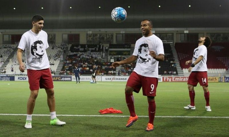 Qatar's national team players wear t-shirts bearing portraits of Emir Sheikh Tamim bin Hamad Al-Thani, in support the Qatari leader in the ongoing Gulf diplomatic crisis as they warm up before their match against South Korea June 13, 2017