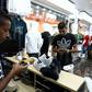 A young Libyan uses a mobile phone app to pay at a Benghazi store that accepts electronic payment systems