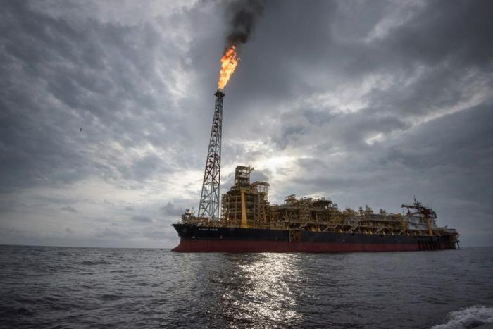 The "Kaombo Norte" is a vast oil-extraction vessel, moored off the coast of Angola