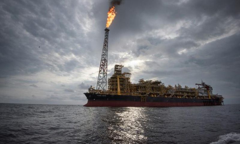The "Kaombo Norte" is a vast oil-extraction vessel, moored off the coast of Angola