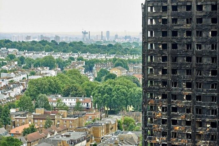 The charred remains of clading on the outer walls of the burnt out shell of the Grenfell Tower block in London have prompted urgent tests in other towers for possible fire risk