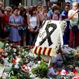 Flowers and candles are placed on Las Ramblas boulevard in Barcelona in tribute to the victims of the twin attacks in Spain