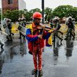 Venezuelan opposition demonstrator Wuilly Arteaga, shown here playing his violin during a May protest against President Nicolas Maduro in Caracas, has been banned from rallies after nearly three weeks in prison Arteaga, 23, was freed overnight on Augus...