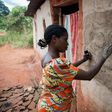 Women in the village of Makwatsha in DR Congo decorate their huts with paintings of local life, a tradition now attracting tourists