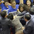 The Taiwan lawmakers' brawl was broken up by about dozen people