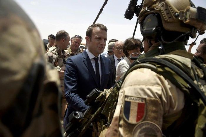 France is attempting to overcome US reservations about financial backing for anti-terrorism forces in the Sahel region of Africa, pictured in May 2017 when French President Emmanuel Macron (C), visited the French troops in northern Mali