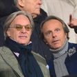 Fiorentina owners Diego (L) and Andrea Della Valle watch the Italian Serie A match against Inter Milan at the Artemio Franchi Stadium in Florence on February 17, 2013
