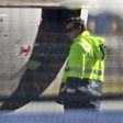 A man inspects the damaged engine cowling of a China Eastern Airbus A330 at Sydney Airport on June 12, 2017