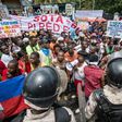 Workers demonstrate in front of Haiti's Ministry of Social Affairs and Labor in Port-au-Prince on July 10, 2017, to demand a raise in the minimum wage