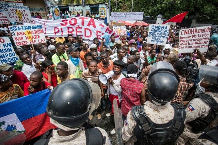 Workers demonstrate in front of Haiti's Ministry of Social Affairs and Labor in Port-au-Prince on July 10, 2017, to demand a raise in the minimum wage