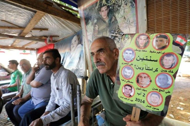 Relatives of Lebanese soldiers taken hostage by jihadists in 2014 sit inside a tent as they gather in downtown Beirut on August 27, 2017 awaiting news of their loved ones