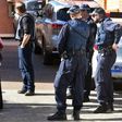 Police direct locals around a block of flats in the Sydney suburb of Lakemba after counter-terrorism raids across the city