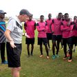 French coach Olivier Perrin gives Generation Foot players a pep talk: the side won the Senegalese national championship in early June