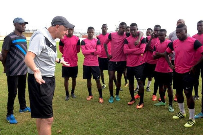 French coach Olivier Perrin gives Generation Foot players a pep talk: the side won the Senegalese national championship in early June