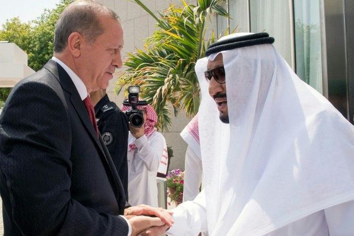 A handout picture provided by the Saudi Royal Palace on July 23, 2017 shows Turkish President Recep Tayyip Erdogan with Saudi Arabia's King Salman