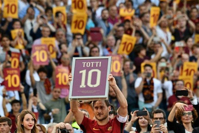 Roma's forward from Italy Francesco Totti holds a framed Number 10 during a ceremony to celebrate his last match on May 28, 2017