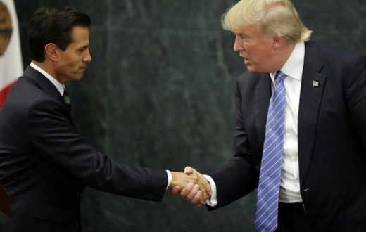 Mexican President Enrique Pena Nieto (L) and US presidential candidate Donald Trump shake hands after a meeting in Mexico City on August 31, 2016