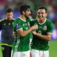 Mexico's Rodolfo Pizarro (L) and Erick Torres celebrate their 1-0 victory over Honduras in the CONCACAF Gold Cup quarter-final match, at the University of Phoenix Stadium in Glendale, Arizona, on July 20, 2017