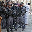 Israeli security forces stand by as Palestinian worshippers gather to pray in the old city of Jerusalem on July 26, 2017