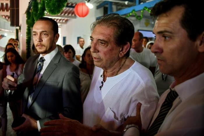 Brazilian "spiritual healer" Joao Teixeira de Faria (C), known as "Joao de Deus" (John of God) arriving at his "healing center" in Abadiania, 120 km southwest of Brasilia