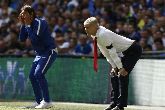 Chelsea's head coach Antonio Conte (L) and Arsenal's manager Arsene Wenger stand along the touchline during the English FA Community Shield football match on August 6, 2017