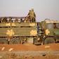 Syrian government soldiers ride in a truck near a border crossing with Jordan on July 6, 2018, after they reseized it from rebel forces