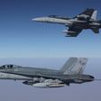 Royal Australian Air Force F/A-18A Hornets fly in formation after refuelling from a KC-30A on a mission over Syria. Australia has temporarily halted air missions following the shooting down of a Syrian jet by US forces