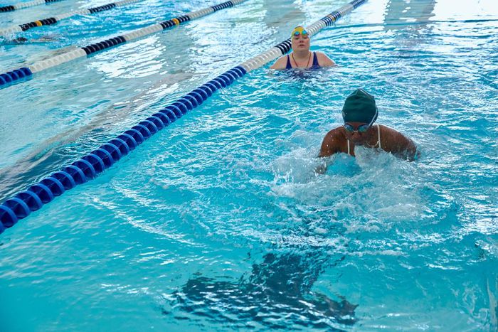 Durbin looks on as Washington swims breast stroke.