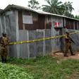 Nigerian drug enforcement officials guard a methamphetamine lab in the village of Obinugwu in the southeast of the country