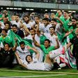 Iranian players celebrate after winning the 2018 World Cup qualifying football match between Iran and Uzbekistan on June 12, 2017