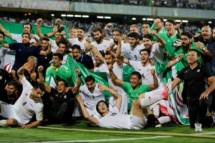 Iranian players celebrate after winning the 2018 World Cup qualifying football match between Iran and Uzbekistan on June 12, 2017
