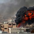 A ball of fire rises from a building following a reported air strike on June 11, 2017 by Syrian forces on a rebel-held area in the southern city of Daraa, which was among areas where a ceasefire took effect on Sunday