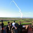 North Korean leader Kim Jong-Un (C, in white shirt) watches the test of a new anti-aircraft guided weapon system organized by the Academy of National Defence Science at an undisclosed location, in an undated picture released on May 28, 2017