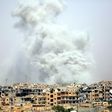 Smoke billows out from Syria's Raqa after a US-led coalition air strike on July 28, 2017, as US-backed forces battle the Islamic State group inside the city
