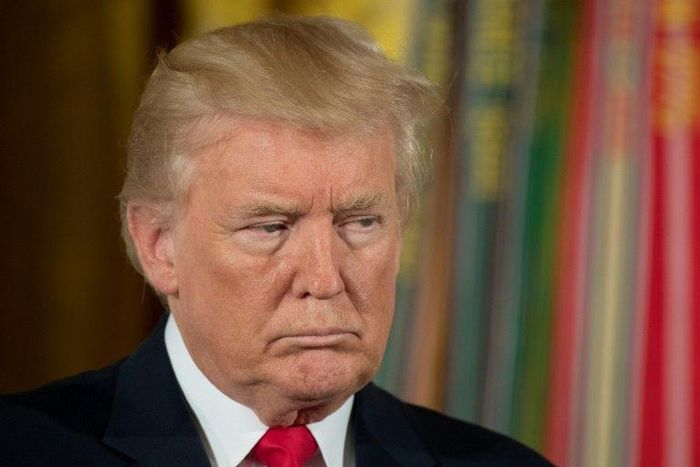 US President Donald Trump, seen here at a Medal of Honor ceremony at the White House, says a Russia sanctions bill is "significantly flawed" but signs it anyway