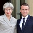 Britain's Prime Minister Theresa May (L) is greeted by France's President Emmanuel Macron ahead of a meeting at The Elysee Palace in Paris on June 13, 2017