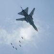 A Syrian warplane drops a payload on the rebel-held area of Qabun east of Damascus on May 6, 2017