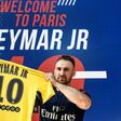 A PSG fan holds a PSG yellow away jersey, marked with the number 10 and the name of Brazilian star Neymar, after he purchased it from the Paris-Saint-Germain (PSG) football club store on the Champs Elysees avenue in Paris on August 4, 2017