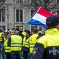 Protestors wearing yellow vests demonstrate in The Hague