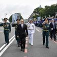 Russia's President Vladimir Putin (centre) walks with officials as he attends a ceremony for Russia's Navy Day in Saint Petersburg on July 30, 2017