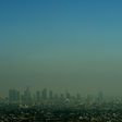 A cloud of smog shrouds the skyline of Los Angeles in California, which has committed to uphold the 2015 Paris climate deal despite Donald Trump's decision to take the US out of it