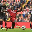 Liverpool's midfielder Sadio Mane shoots to score the opening goal of the English Premier League football match against Crystal Palace August 19, 2017