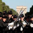 Pupils of the Ecole Polytechnique, promotion X2016, cross their sowrds as they wait for the start of the annual Bastille Day military parade on the Champs-Elysees avenue in Paris, on July 14, 2017