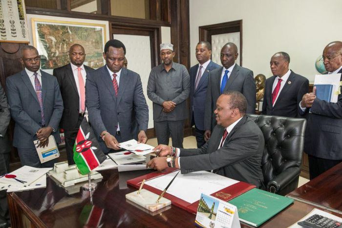 President Uhuru Kenyatta when he signed the Finance Bill 2018 on Friday