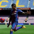 Barcelona's new signing Paulinho Bezerra kicks a ball during his official presentation, at the Camp Nou stadium in Barcelona, on August 17, 2017